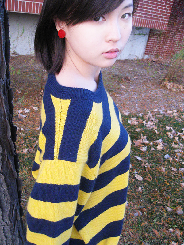 The yellow of the leaves in the background and the yellow in Peggy Wu's sweater make her earrings all the more important -- adding the right splash of color. (Photo by Priya Kailash / Student Voice) The yellow of the leaves in the background and the yellow in Peggy Wu's sweater make her earrings all the more important -- adding the right splash of color. (Photo by Priya Kailash / Student Voice)